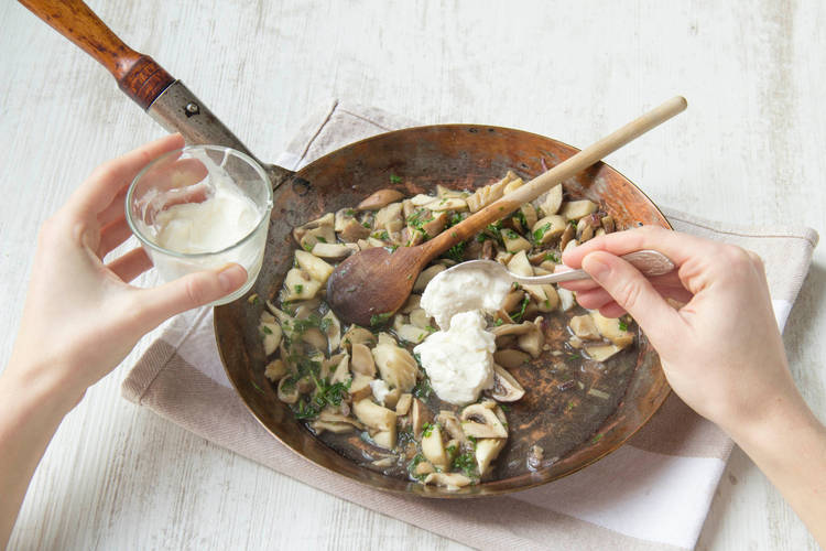 Stir sour cream to the pan