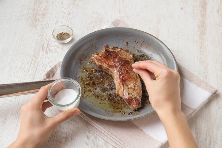 Brush the steaks with the garlic