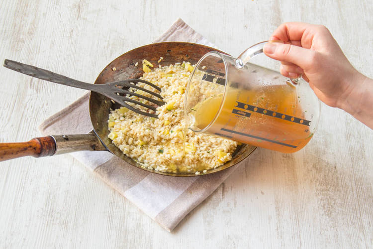 Cook the rice with the stock