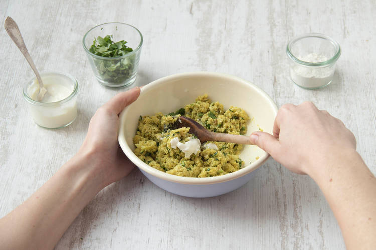 Mix in the flour, coriander, cheese and yoghurt