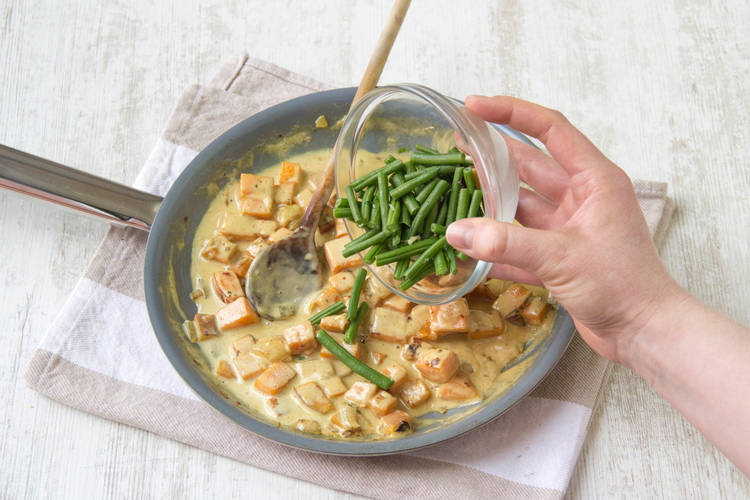 Add green beans to the curry