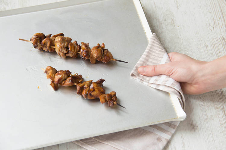 Cook chicken skewers