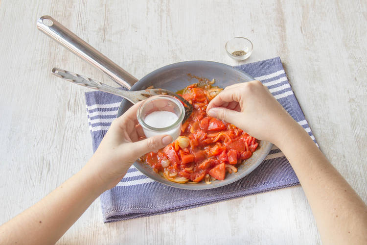 Season tomatoes with salt