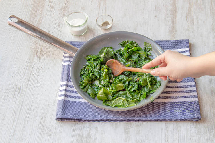 Cook spinach and garlic