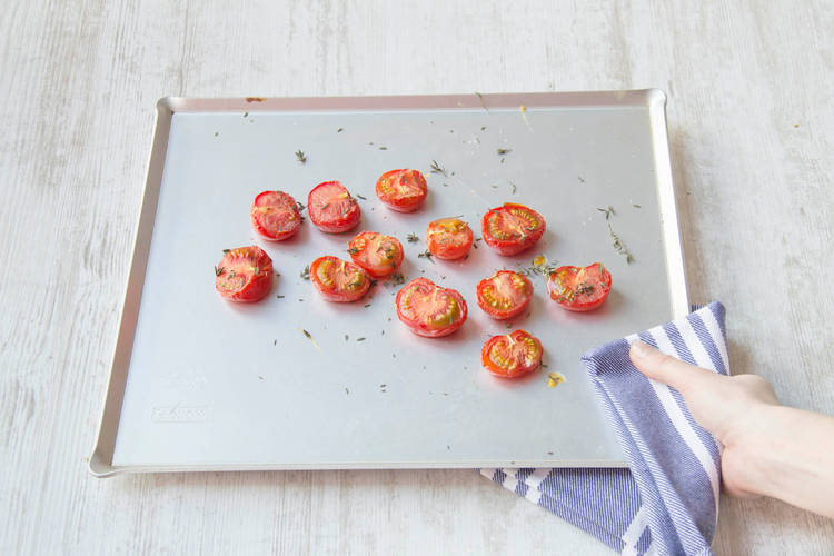 Place the tomatoes on the baking tray