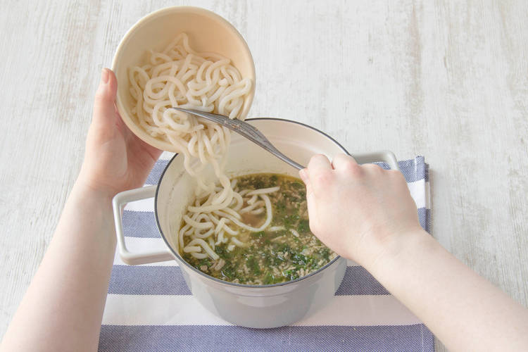 Add udon noodles and cook until al dente