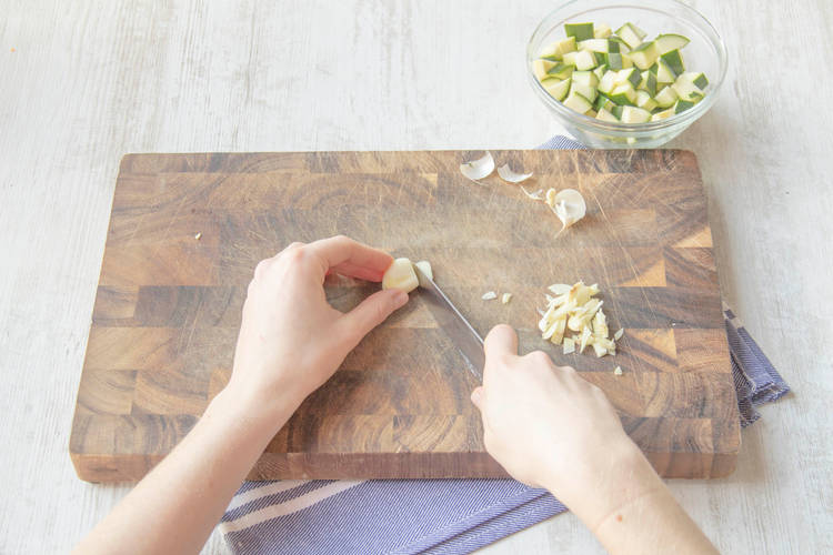 Peel and very finely chop the garlic