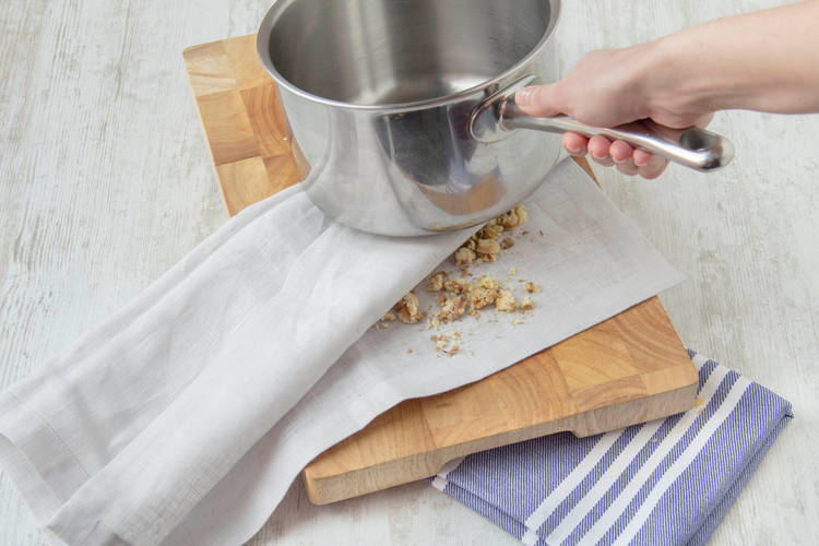 Whack them gently with a saucepan