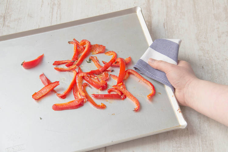 Toss bell pepper on backing sheet