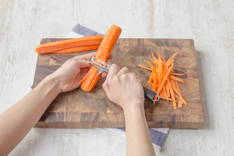 Finely shave carrots