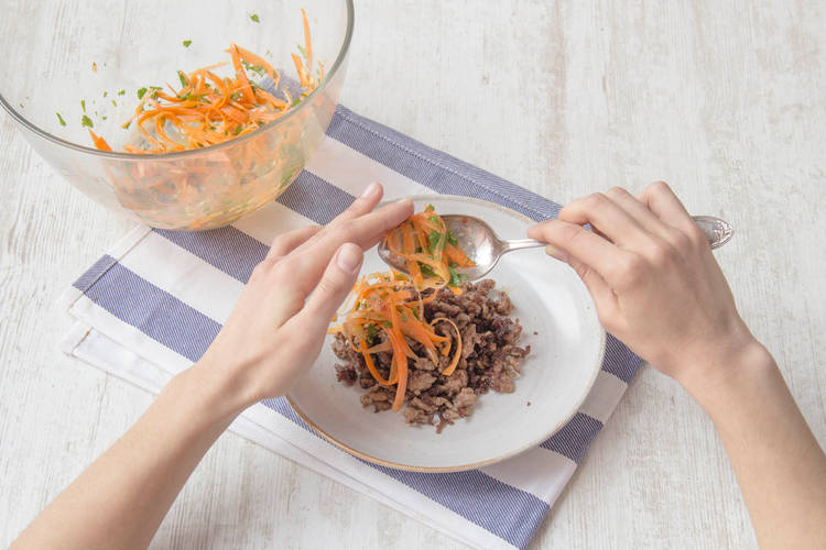 Serve spiced lamb with carrot salad and pappadums