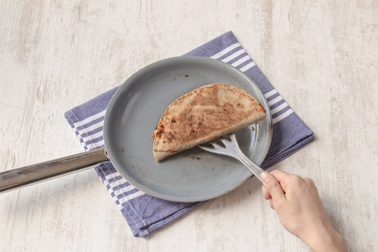 Fry each side of the quesadilla until golden brown.
