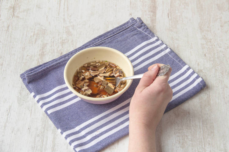 Soak the dried porcini mushrooms in warm water.