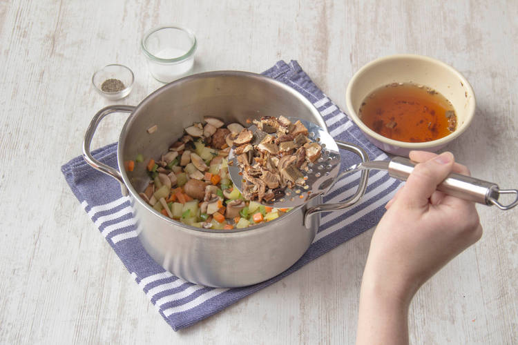 Add the stock and porcini water to the pan