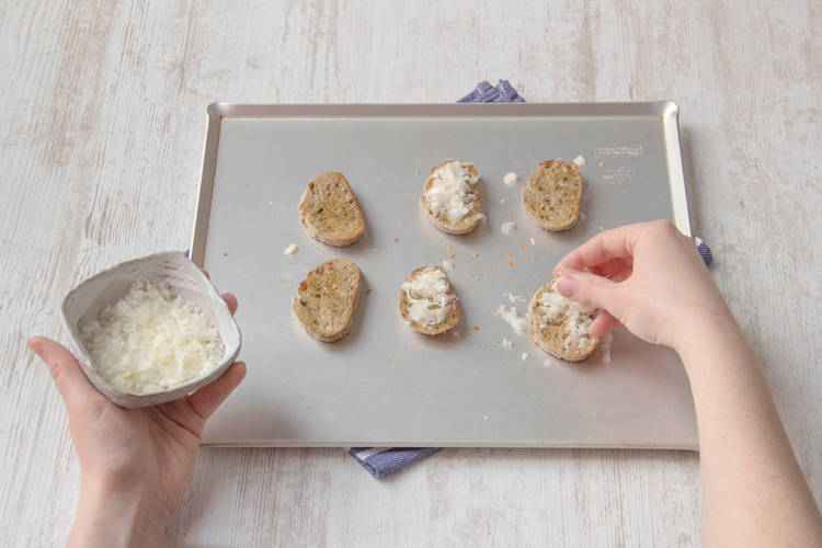 Top the bread with the hard Italian cheese and put back in the oven until the cheese melts.