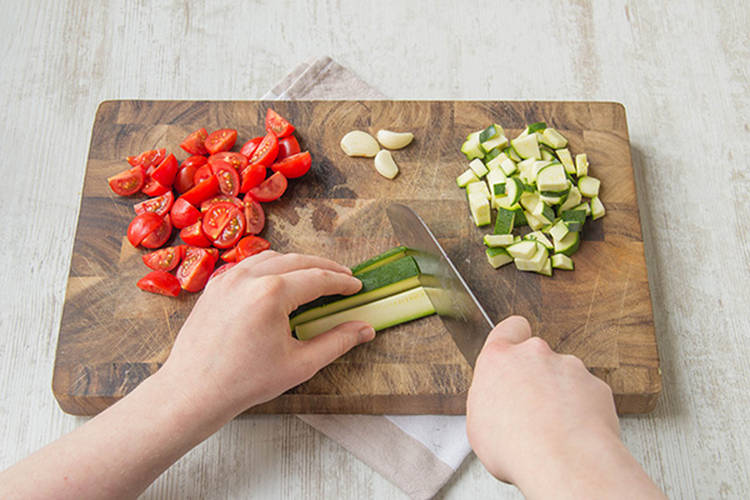Chop cherry tomatoes and cube courgette