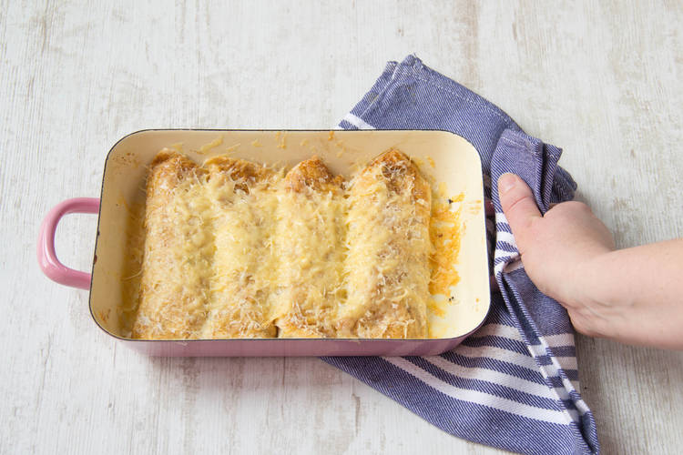 Stuff wraps with mixture, grate cheese on top, and bake in oven until cheese melts