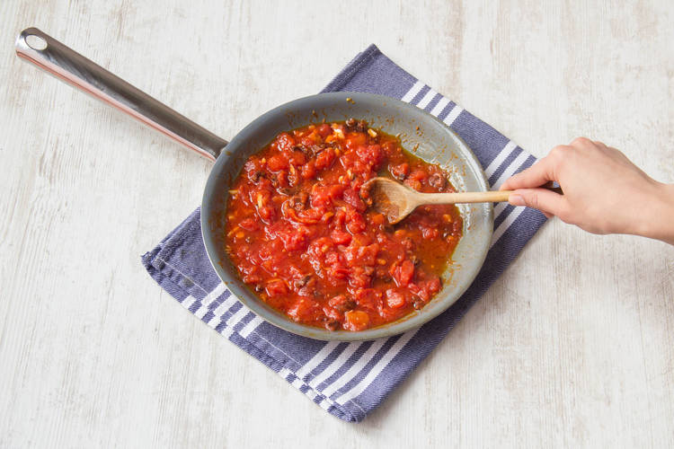 Add in chopped tomatoes and the smoked paprika