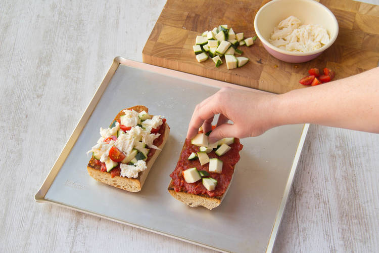 Sprinkle on your courgette cubes and a few cherry tomato quarters