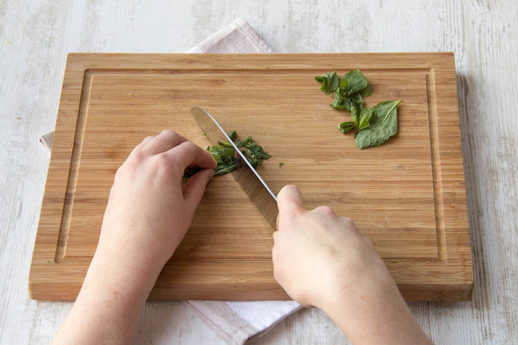 Roughly chop half of the mint