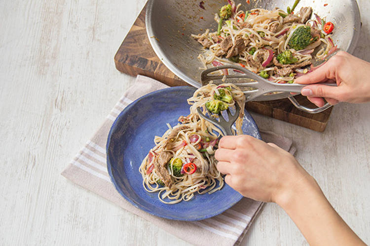 Add the noodles to the vegetables