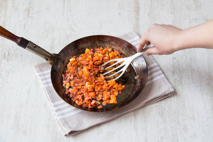 Stir till tomato starts to break down