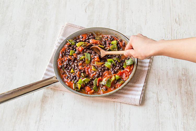 Stir in the beans and the peppers