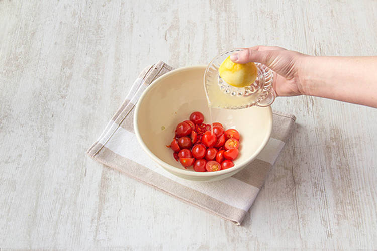 Combine tomatoes and lemon juice