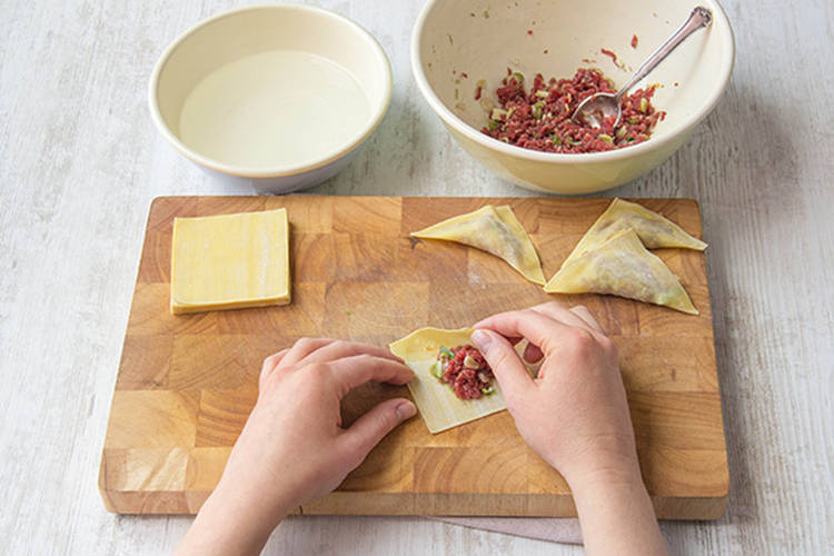 Wrap beef in wonton wrappers