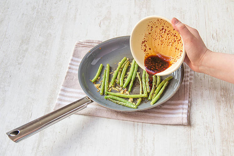 Add soy sauce mixture to beans