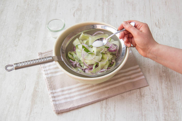 Leave the mix of onion and cucumber in the colander