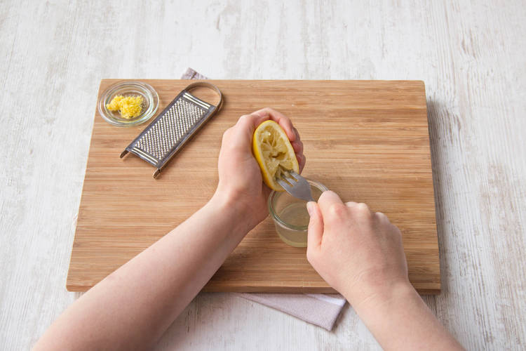 Use a fork to squeeze the lemon juice
