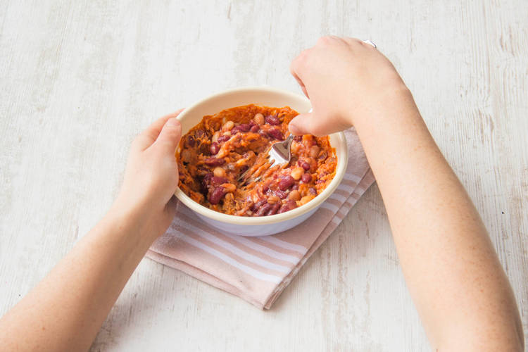 Mash the beans to a paste using the back of a fork