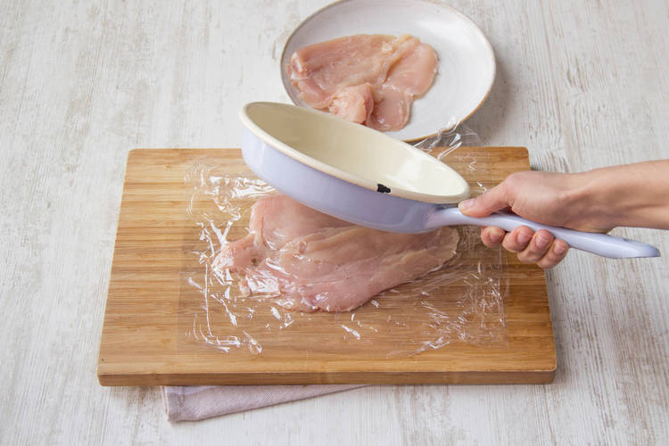 Cover and and pound the chicken breasts