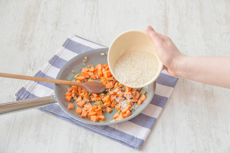 Add the rice to the carrot mix