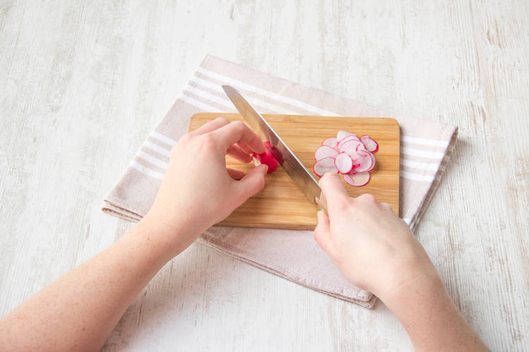 Thinly slice the radishes
