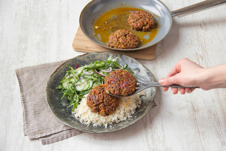 Place the rissoles on the rice