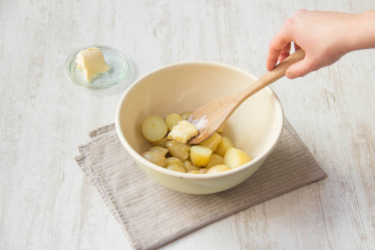 Toss butter to the potatoes