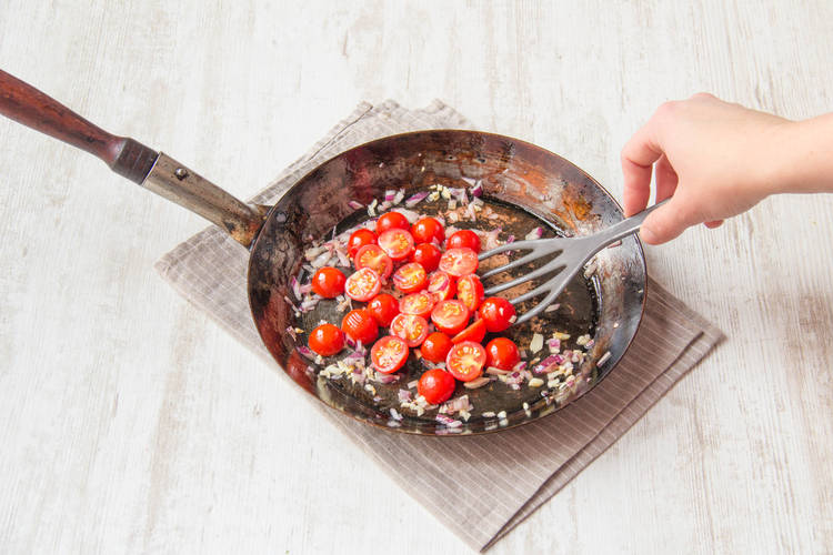 Add in the halved cherry tomatoes