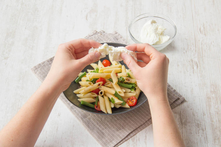 Add in the torn mozzarella