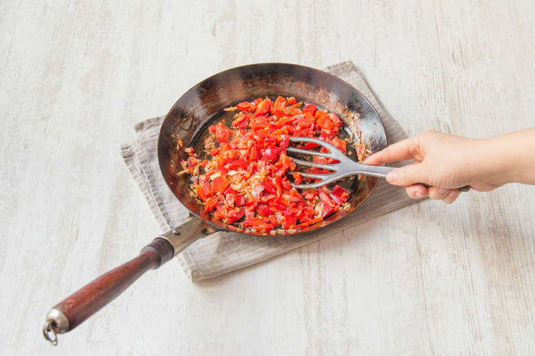 Add the red onion and large red pepper squares
