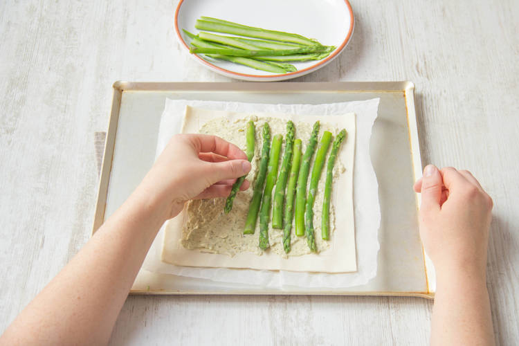 Place the drained asparagus over the mixture