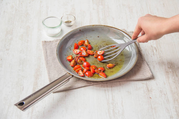 Mix in a third of the tomatoes