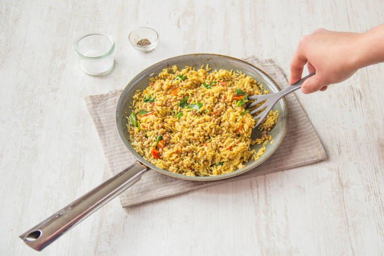 Stir the spinach through the rice
