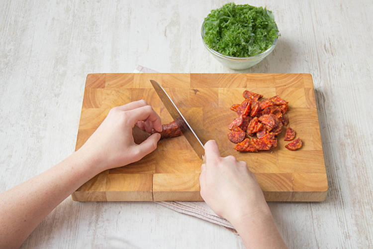 Chop kale, chorizo, parsley and garlic