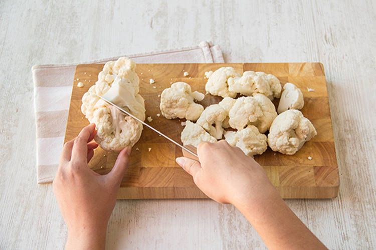 Cut the cauliflower into florets