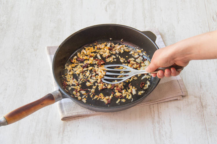 Fry off garlic, onion, sun-dried tomato and chilli flakes