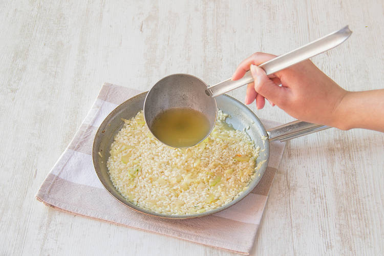 Add ½ a cup of stock to the rice