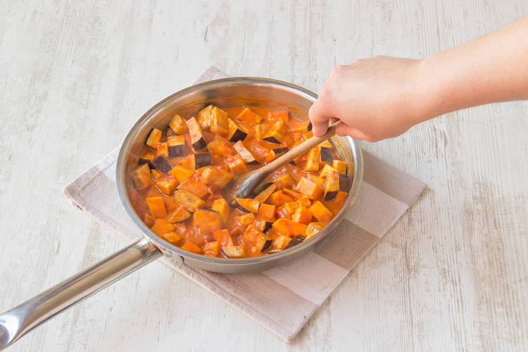 Add the squash, aubergine and chickpeas into the coconut mixture