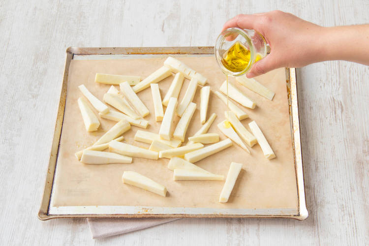 Place parsnip fries onto a lined baking tray